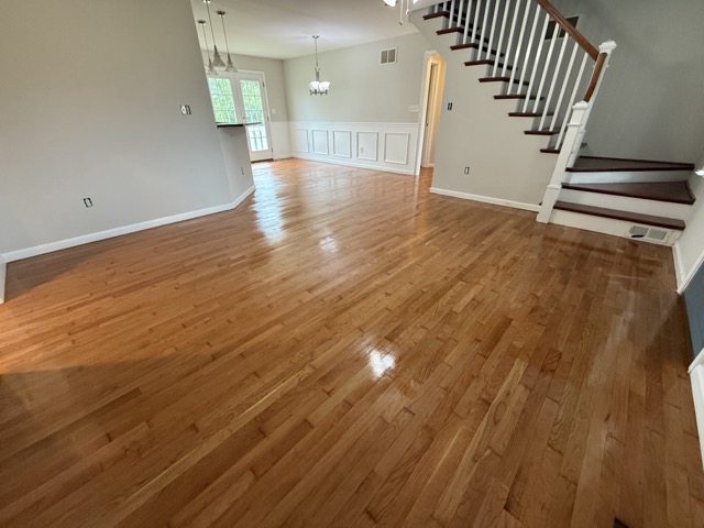 Great room featuring professionally refinished hardwood floors by Flawless Floors in Baltimore, MD.