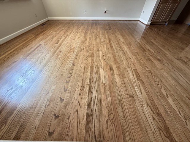 Open living space featuring professionally refinished hardwood floors in Baltimore, MD.