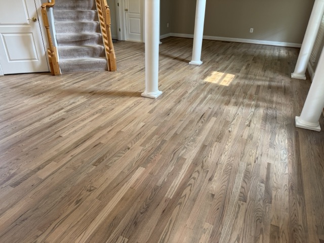 Hardwood floor refinishing completed inside a waterfront home by Flawless Floors in Baltimore, MD.