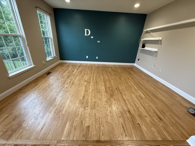 Hardwood floor restoration completed in a Baltimore, MD home office by Flawless Floors.