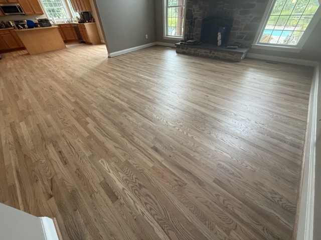 Professional hardwood floor refinishing completed throughout a Baltimore, MD home by Flawless Floors.
